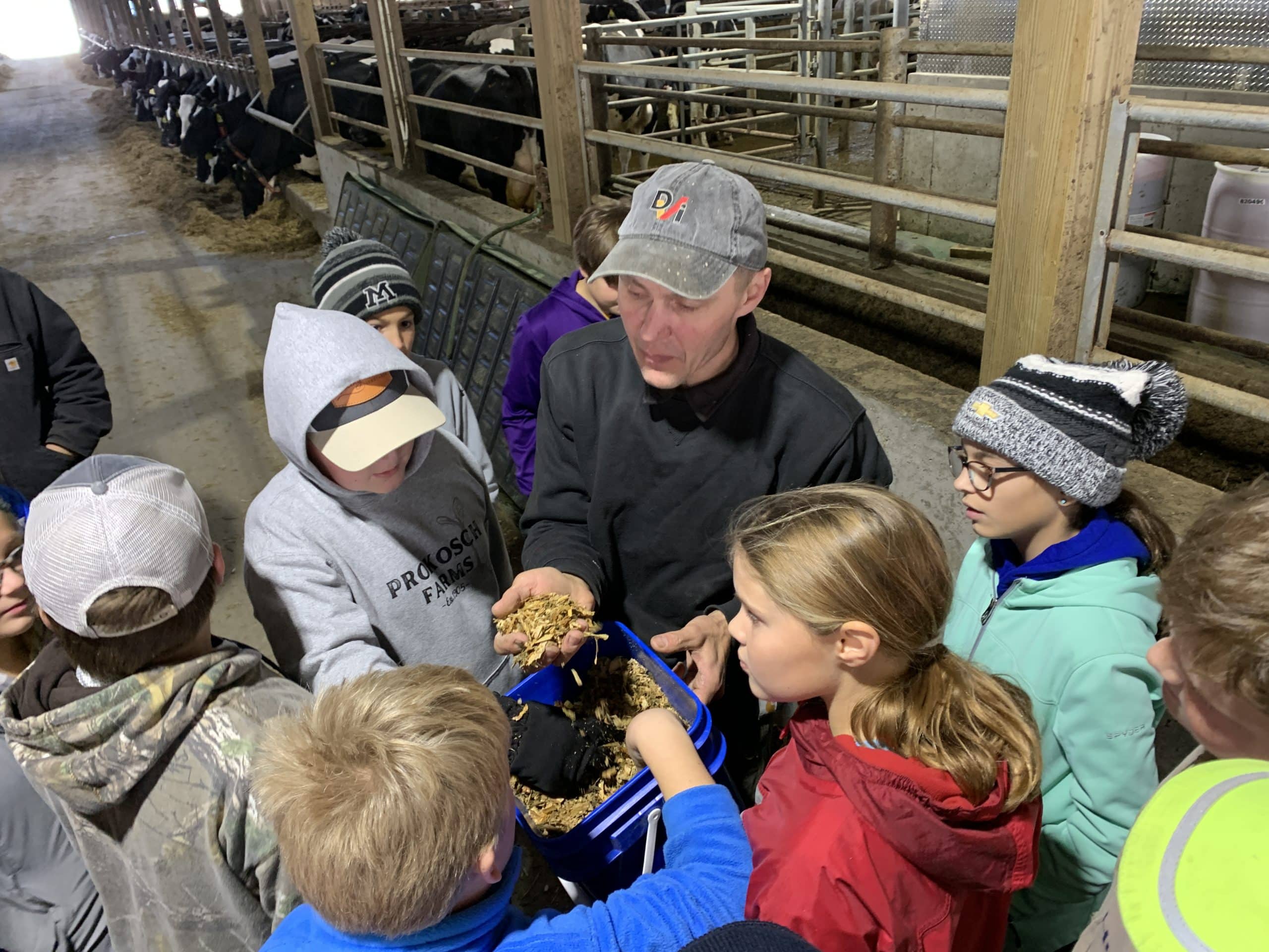 Dairy Farmer allows students to smell feed