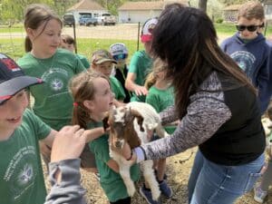 child holding goat