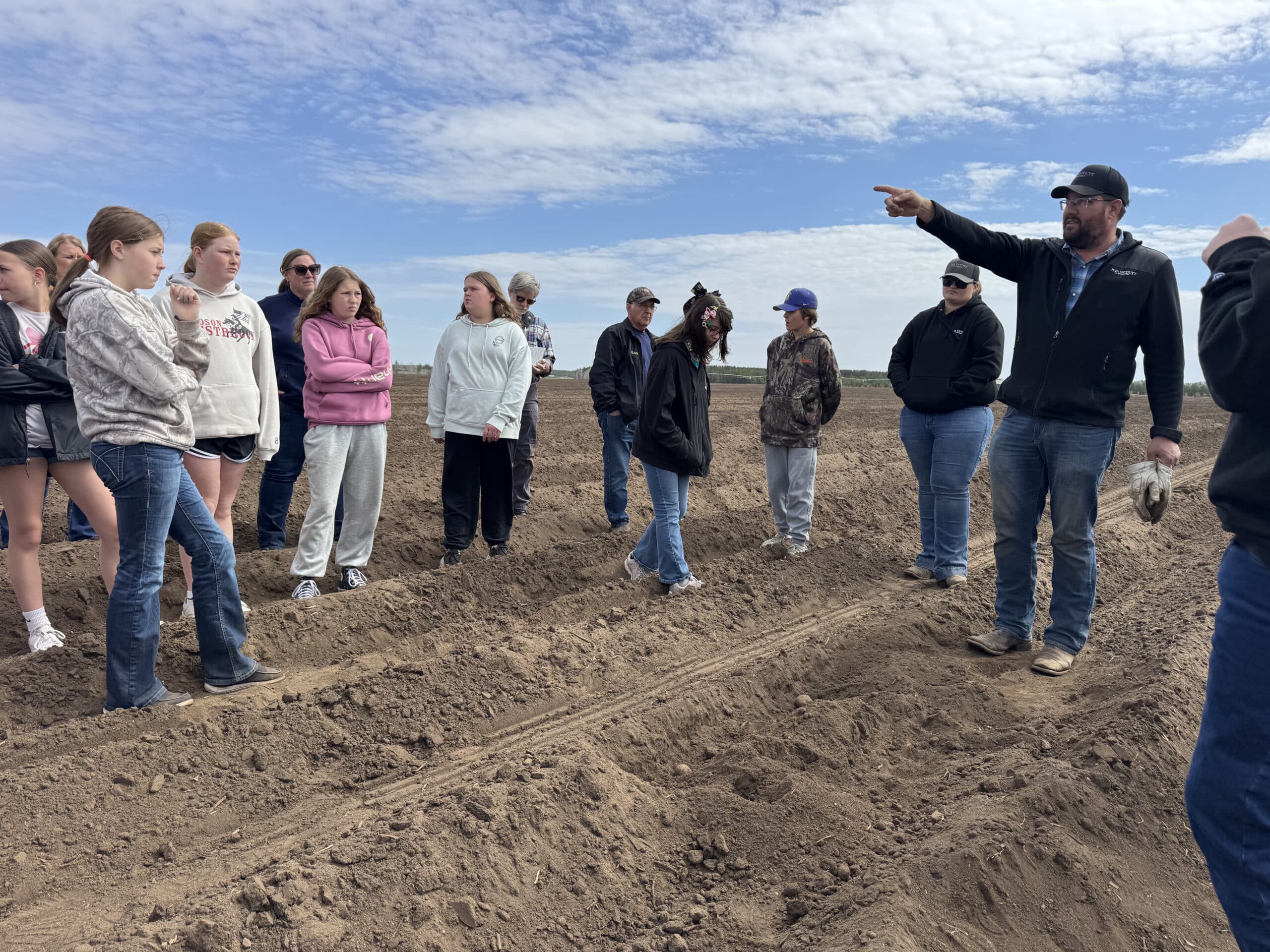 Farm Camp students tour a potato field